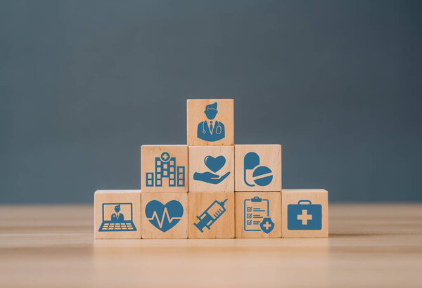 Wood block stacking with icon healthcare medical, Insurance for your health concept. Life insurance concept.