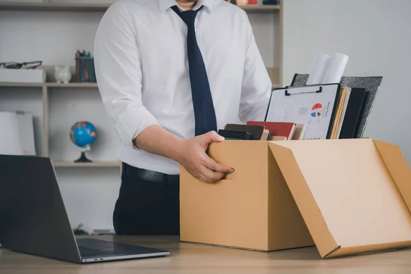 Quitting a job,The big quit. The great Resignation. Resignation. Businessmen hold boxes for personal belongings and resignation letters