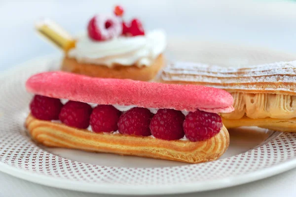 Close French Eclair French Baba Rhum Tea Room — Stock Photo, Image