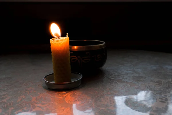 Candle Burns Tibetan Bowl High Quality Photo — 图库照片
