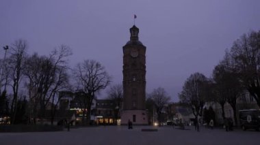 timelapse. Night comes in the city near the ancient tower. High quality FullHD footage