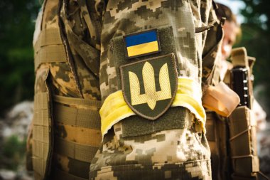 Chevron Ukrainian trident on the sleeve of the military. High quality photo
