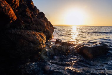 bright sunrise over the Red Sea and fawns in Africa. High quality photo