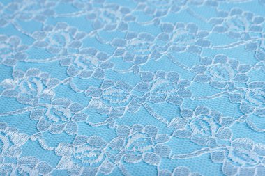 Mavi kumaş arka plan. Dantelli arka plan. Seçici odaklanma. Kopyalanacak bir yer.