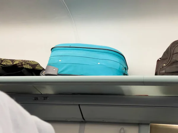 Travel Luggage on the shelf of a train