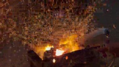 Particles of burning coal fire flames jump up with red flakes