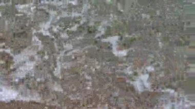 Closeup of the Mediterranean Sea waves splashing on a sandy beach