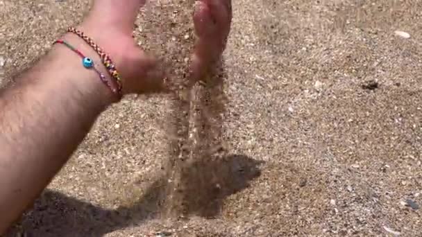 Male Hand Pouring Sand Beach — Vídeos de Stock