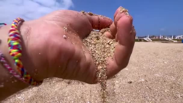 Male Hand Pouring Sand Beach — Wideo stockowe