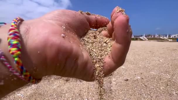 Male Hand Pouring Sand Beach — Vídeo de Stock