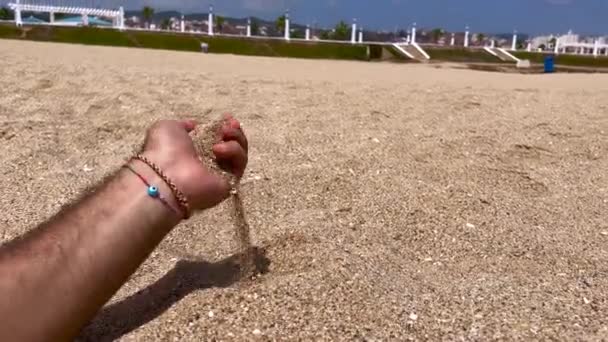 Male Hand Pouring Sand Beach — Vídeo de Stock