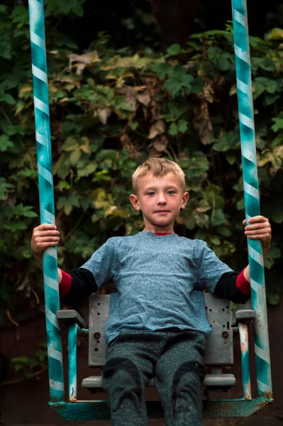 Boy Swings Swing Backyard Autumn — Stockfoto