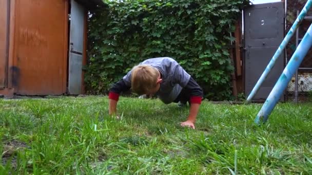Boy Does Push Ups Floor Yard — Stockvideo