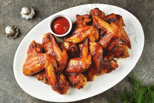 Grilled chicken wings in soy sauce with honey.