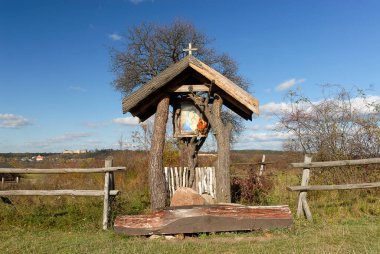 A roadside shrine on an autumn sunny day, Poland clipart