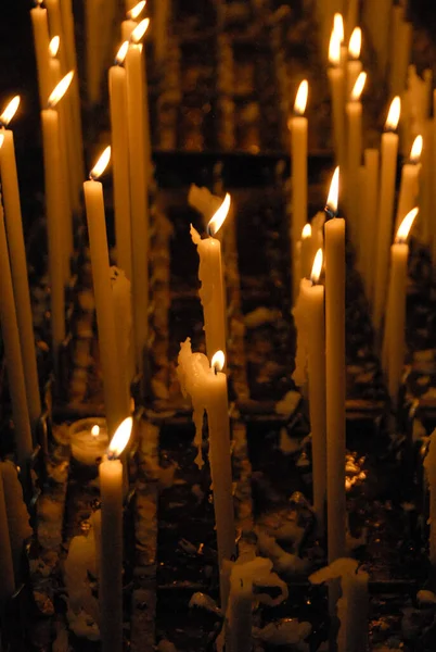 Yellow Burning Wax Candles Dark Background — Fotografia de Stock