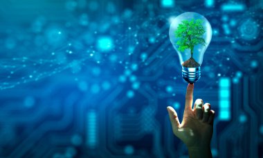 Ampulün içinde büyüyen el ele tutuşan ağaç. Ekoloji ve Teknoloji Yakınsaması. Green Computing, Green Technology, Green IT, CSR ve IT etik kavramı.