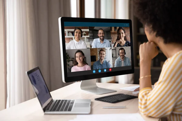 Concentrated young african american businesswoman holding video conference call. — Stock Photo, Image