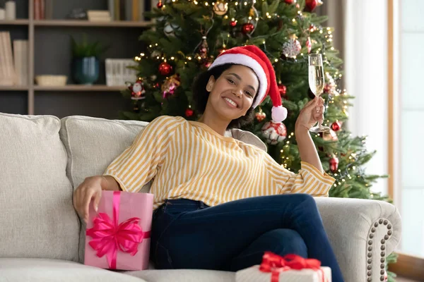 Portrait of festive young african american woman celebrating winter holidays. — Stock Photo, Image