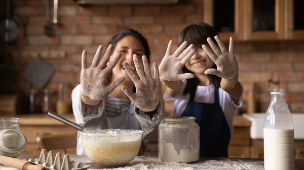 Happy excited mom and daughter baking together — Stock Photo, Image