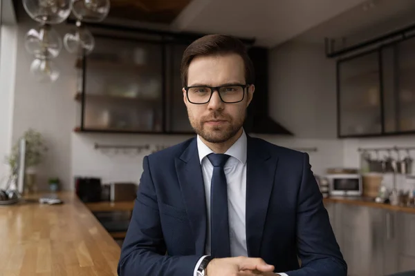 Concentrated caucasian young businessman holding video call meeting. — Stock Photo, Image