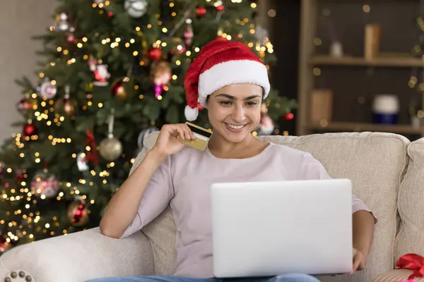 Smiling millennial Indian woman shopping online on computer. — Stock Photo, Image