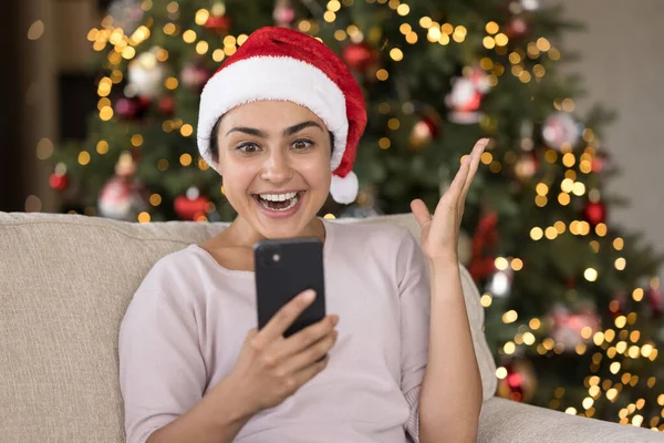 Happy amazed young Indian woman celebrating online lottery win. — Stock Photo, Image