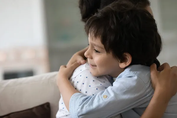 Happy Indian preschool boy embracing beloved mom with love — Stock Photo, Image