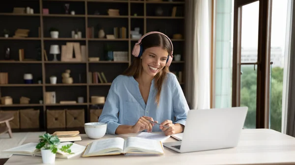 Happy attractive millennial woman holding video call meeting. — Stock Photo, Image