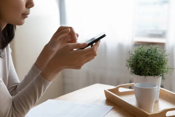 Close up of female using smartphone typing message, buying online — Stock Photo, Image