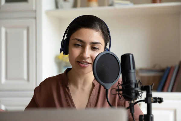 Beautiful young indian woman recording song or voice acting. — Stock Photo, Image