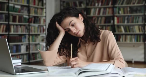 Unmotivated girl student feeling lack of ideas while writing essay — Stock Video