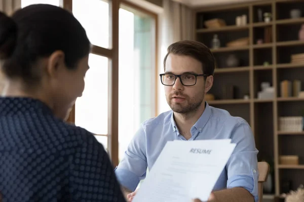 Female company leader, director, recruiter reviewing paper resume — Stock Photo, Image