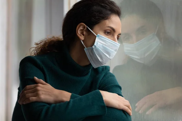 Unhappy Latino woman in facemask feel lonely on lockdown — Stock Photo, Image