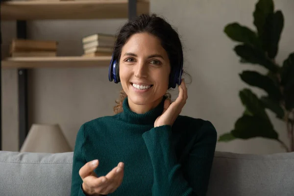 Portrait of young Latin woman in headphones talk on webcam — Stock Photo, Image