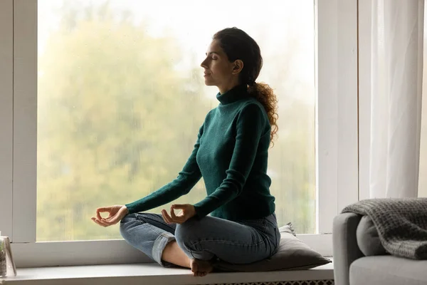 Calm Latin woman meditate practice yoga at home — Stock Photo, Image