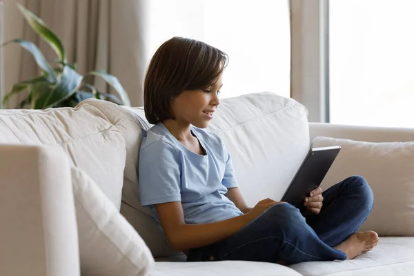 Happy teen kid boy using digital computer tablet. — Stock Photo, Image