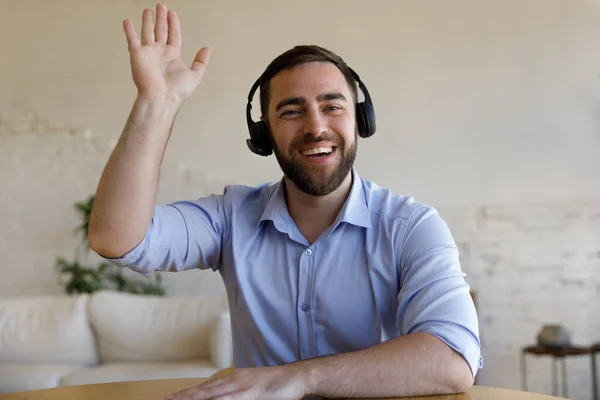 Happy sincere young man holding video call conversation. — Stock Photo, Image