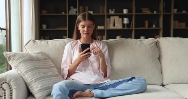 Young woman read great news feels excited celebrate success — Stockvideo