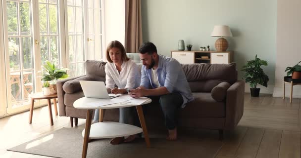 Married couple talk plan family mortgage loan at home office — Vídeo de Stock