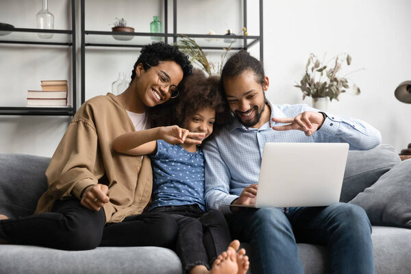 Happy parents and gen Z daughter kid waving hand hello