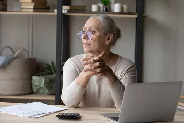 Stressed pensive middle aged woman having financial problems. — Stock Photo, Image