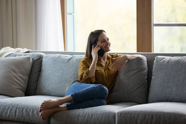 Happy joyful millennial girl speaking on smartphone — Stock Photo, Image