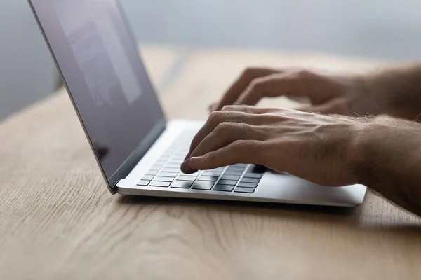 Crop close up male hands typing on laptop keyboard — ストック写真