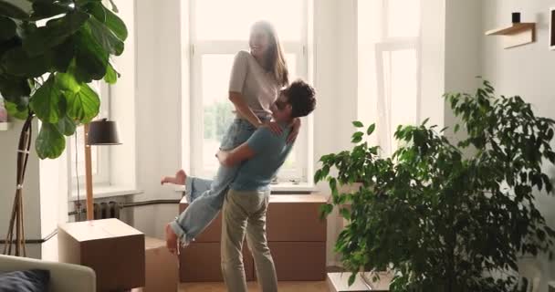 Happy millennial couple celebrate relocation day to own house — 비디오