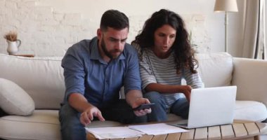 Couple review overdue loan payments feel stressed