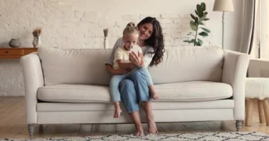 Mom and daughter use cellphone communicating via video call app