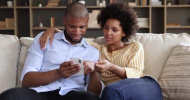 Loving millennial Afro American spouses book tickets online using cell