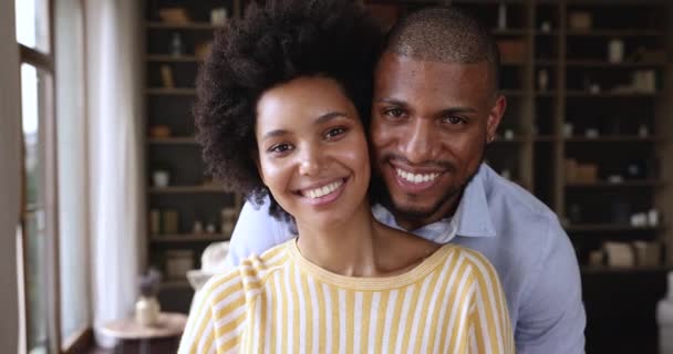 Happy millennial Black husband wife smiling looking at camera indoors — Vídeo de Stock