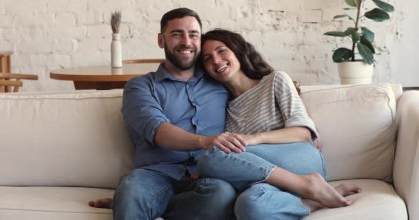 Cheerful couple relaxing at home looking aside enjoy weekend leisure — Stockvideo